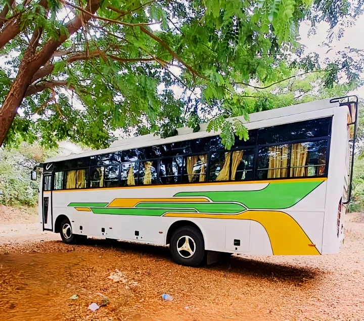 45-seater non-AC bus side profile, available for pilgrimage tours