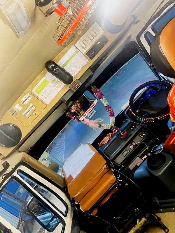 20-seater AC Tempo Traveller dashboard and driver cabin view
