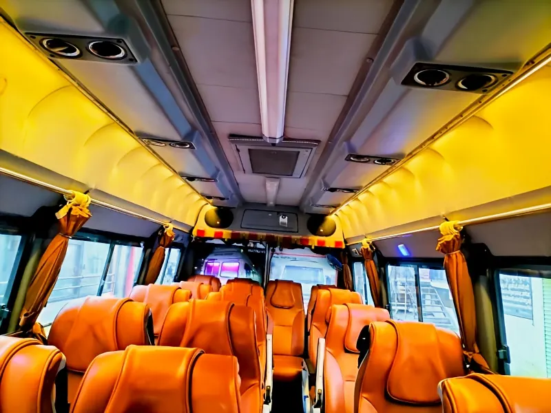 Full interior view of 17-seater non-AC Tempo Traveller seating